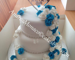 White Wedding Cake with Blue and White Flowers