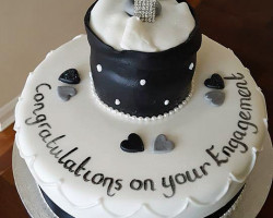 white-and-black-engagement-cake-with-ring by Wedding Cakes Middlesbrough